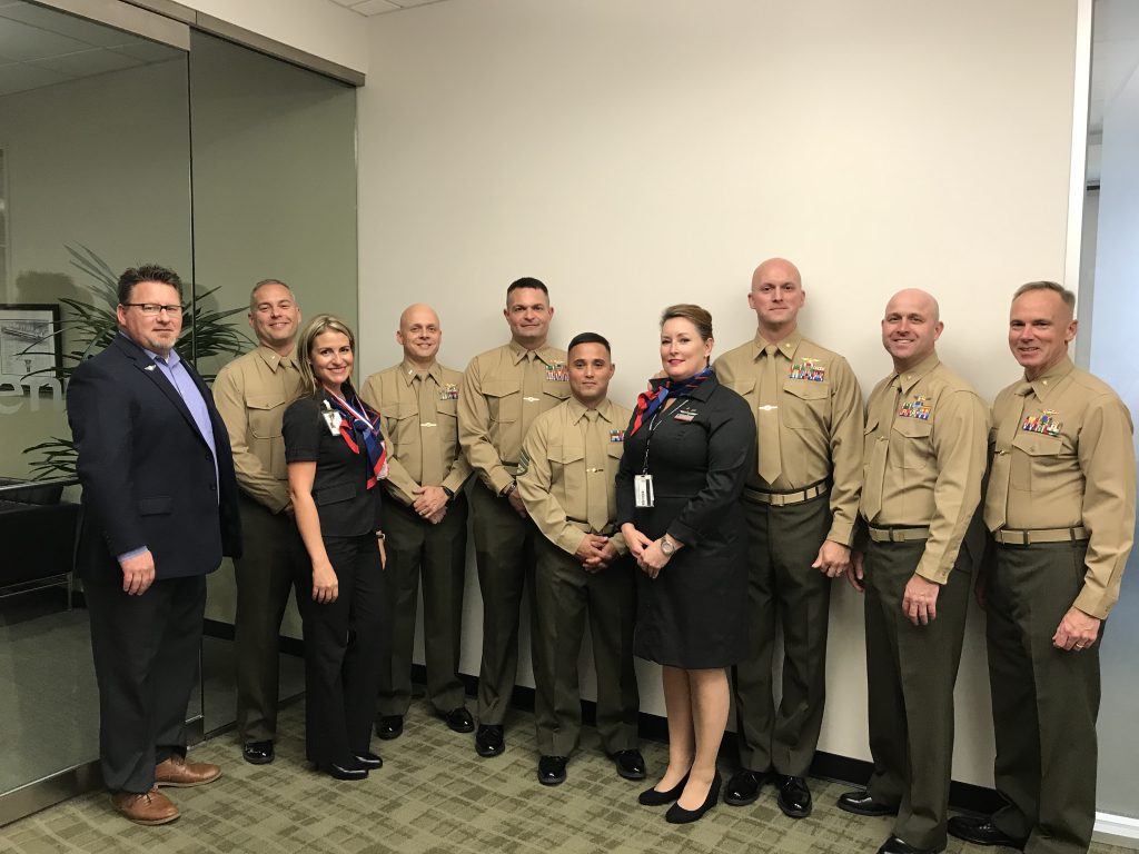 The visiting Marines pose for a photo with Brian Anderson (Leadership Training specialist) and Flight Attendants Mayra Rosado-Pellot (left) and Elizabeth Bustamante (right). IMG-EHQ-Marines-visit-Envoy-3.JPG