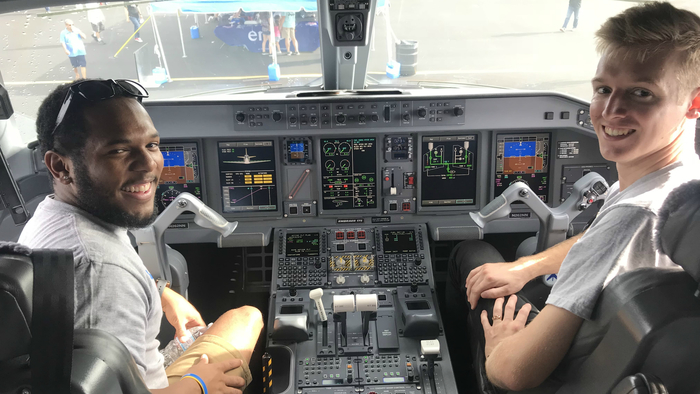Keith with a friend on the flight deck of an Embraer 175 operated by Envoy at the Homestead Air Show in 2018. 