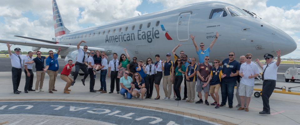 Team Envoy poses in front of an E175 at ERAU Daytona