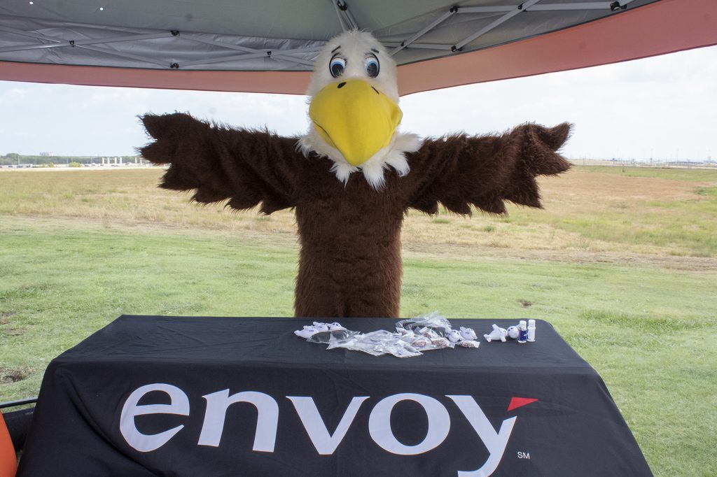RJ the Eagle stands with his wings spread at the Envoy booth at Founders' Plaza.